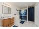 Clean bathroom with wood vanity and ocean-themed shower curtain at 6023 Twyckenham Dr, Indianapolis, IN 46236