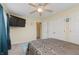 Bedroom with double bed, TV, and plenty of closet space at 6023 Twyckenham Dr, Indianapolis, IN 46236