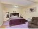 Comfortable bedroom with a double bed and hardwood floors at 6023 Twyckenham Dr, Indianapolis, IN 46236