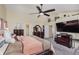 Main bedroom with a large bed, TV, and plenty of closet space at 6023 Twyckenham Dr, Indianapolis, IN 46236