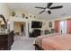 Main bedroom with large bed, TV and access to hallway at 6023 Twyckenham Dr, Indianapolis, IN 46236