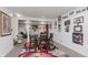 Basement dining area with glass table and a Wall of Fame at 6023 Twyckenham Dr, Indianapolis, IN 46236