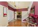 Bright two-story foyer with hardwood floors, elegant staircase, and double doors at 6023 Twyckenham Dr, Indianapolis, IN 46236