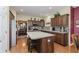 Updated kitchen with an island, stainless steel appliances, and wood cabinets at 6023 Twyckenham Dr, Indianapolis, IN 46236