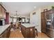 Open concept kitchen with island and breakfast bar at 6023 Twyckenham Dr, Indianapolis, IN 46236
