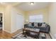Cozy living room with gray sofa and wood coffee table at 6023 Twyckenham Dr, Indianapolis, IN 46236