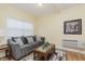Comfortable living room with gray sofa and wood coffee table at 6023 Twyckenham Dr, Indianapolis, IN 46236