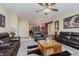 Spacious living room with leather sofas and a large coffee table at 6023 Twyckenham Dr, Indianapolis, IN 46236