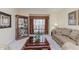 Spacious living room with comfortable leather sofas and a large coffee table at 6023 Twyckenham Dr, Indianapolis, IN 46236