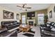 Gathering room with fireplace, large TV, and comfortable seating at 6023 Twyckenham Dr, Indianapolis, IN 46236