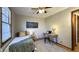 Charming bedroom with twin bed, desk and city view art at 7385 E Troy Ave, Indianapolis, IN 46239