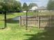 Backyard with a pond, chain link fence, and wooden fence at 892 Millbrook Dr, Avon, IN 46123