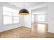 Dining room with herringbone floors and large windows at 1003 Alabama St, Indianapolis, IN 46202