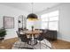 Modern dining room with hardwood floors and a round wooden table at 1003 Alabama St, Indianapolis, IN 46202