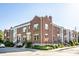 Charming brick townhomes featuring well-manicured landscaping and classic architectural details, enhancing curb appeal at 1003 Alabama St, Indianapolis, IN 46202