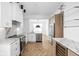 Modern kitchen with marble countertops and herringbone floors at 1003 Alabama St, Indianapolis, IN 46202