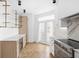 Modern kitchen with marble countertops and herringbone floors at 1003 Alabama St, Indianapolis, IN 46202