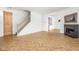 Living room with herringbone floors, fireplace, and view into the kitchen at 1003 Alabama St, Indianapolis, IN 46202