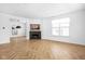 Living room with herringbone floors, fireplace, and large windows at 1003 Alabama St, Indianapolis, IN 46202