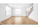 Bright living room with herringbone floors and large windows at 1003 Alabama St, Indianapolis, IN 46202