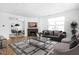 Bright living room with hardwood floors, fireplace, and stylish furniture at 1003 Alabama St, Indianapolis, IN 46202