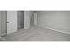Neutral bedroom features plush carpet, closet, and white doors at 1069 Ridgevine Rd, Greenwood, IN 46143