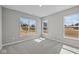 Bright bedroom features carpet, three large windows, and neutral paint, creating a serene space at 1069 Ridgevine Rd, Greenwood, IN 46143