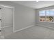 Bright bedroom featuring plush carpeting, neutral walls, and a large window at 1069 Ridgevine Rd, Greenwood, IN 46143