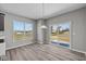 Bright dining area with a view of the backyard, featuring a sliding glass door at 1069 Ridgevine Rd, Greenwood, IN 46143
