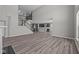 Open-concept living room leading to kitchen with tall ceilings and modern finishes at 1069 Ridgevine Rd, Greenwood, IN 46143