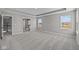 Large main bedroom with carpet, tray ceiling, and ensuite bathroom with glass shower at 1069 Ridgevine Rd, Greenwood, IN 46143