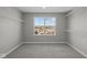Spacious walk-in closet with carpeted floor, shelving and natural light at 1069 Ridgevine Rd, Greenwood, IN 46143