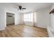 Spacious living room featuring hardwood floors and a fireplace at 109 N State St, Markleville, IN 46056