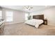 Spacious main bedroom with carpeted floor and large windows at 12346 Palmetto Bay St, Fishers, IN 46037