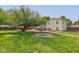 Backyard with firepit, deck, and landscaping at 1801 Witt Rd, Lebanon, IN 46052