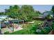 Spacious backyard with pergola, playset, and a hammock under a large tree at 1801 Witt Rd, Lebanon, IN 46052
