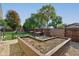 Large backyard with raised garden beds and playground at 1801 Witt Rd, Lebanon, IN 46052