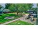 Large backyard with fire pit, water feature, and a hammock under a large tree at 1801 Witt Rd, Lebanon, IN 46052