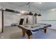 Finished basement features a pool table, home gym, and bar area at 1801 Witt Rd, Lebanon, IN 46052