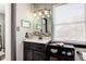 Dark wood vanity with a modern sink and updated lighting at 1801 Witt Rd, Lebanon, IN 46052