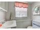 Simple bathroom with toilet, sink, and a window at 1801 Witt Rd, Lebanon, IN 46052
