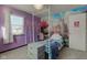 Purple bedroom with a castle mural and a four-poster bed at 1801 Witt Rd, Lebanon, IN 46052