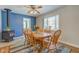 Dining room with wood table and chairs, wood floor, and wood burning stove at 1801 Witt Rd, Lebanon, IN 46052