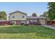 Ranch style home with brick and siding exterior, a deck, and a well-manicured lawn at 1801 Witt Rd, Lebanon, IN 46052