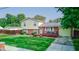 Two-story house with a landscaped yard and deck at 1801 Witt Rd, Lebanon, IN 46052