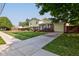 House exterior showcasing a spacious lawn, driveway, and wooden fence at 1801 Witt Rd, Lebanon, IN 46052