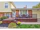 Inviting front porch with deck, railing, and comfortable seating at 1801 Witt Rd, Lebanon, IN 46052
