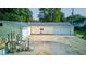 Rear view of house showing a two-car garage, driveway, and above-ground pool at 1801 Witt Rd, Lebanon, IN 46052