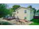 Back of house with deck, pond, and landscaping at 1801 Witt Rd, Lebanon, IN 46052