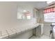 Laundry room with tiled countertop and built-in cabinets at 1801 Witt Rd, Lebanon, IN 46052